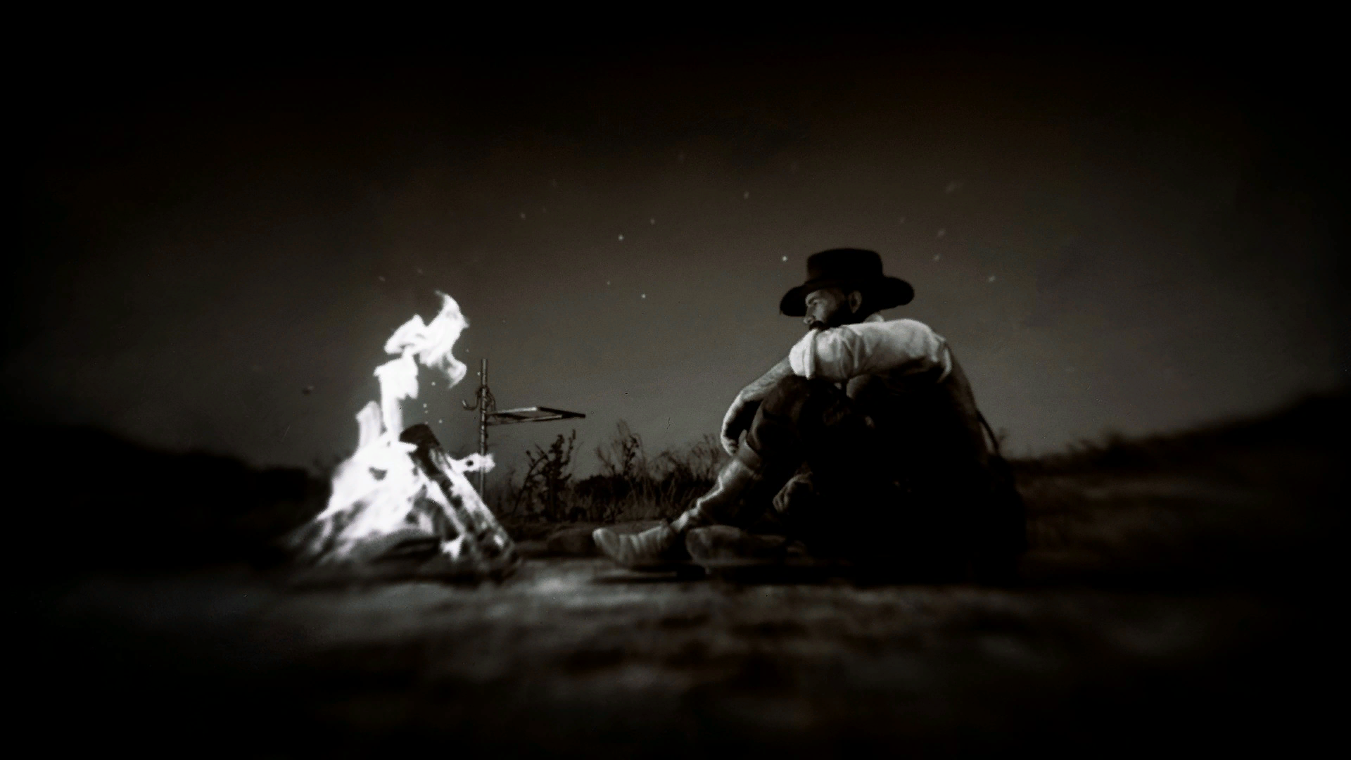 野外燃起篝火獨自過夜，作為一名西部浪子，想必亞瑟這一生度過了數不清有多少次這樣的夜。