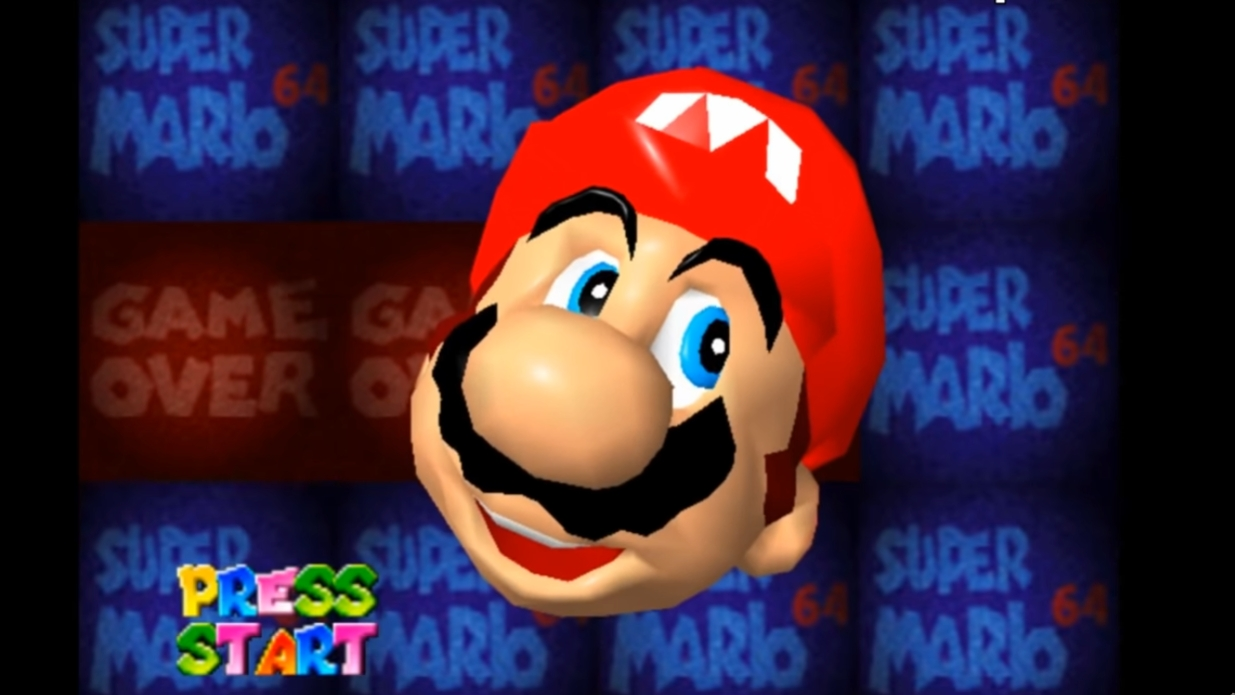 圖為《超級馬里奧 64》中 GAMEOVER 的畫面，即使失敗，馬里奧也面帶笑容