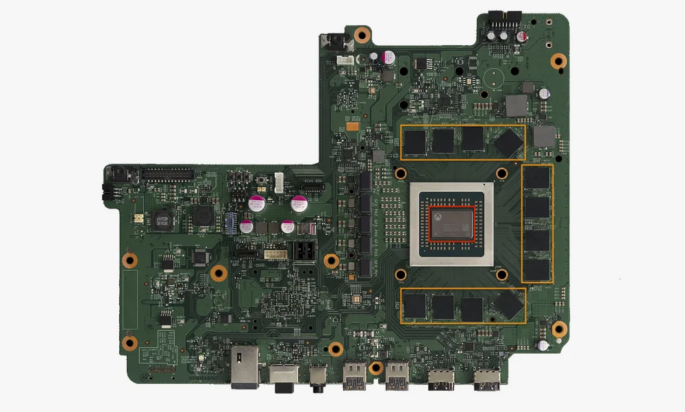 Xbox One X 的主板，红色区域为APU，尺寸更是比Xbox One大得多